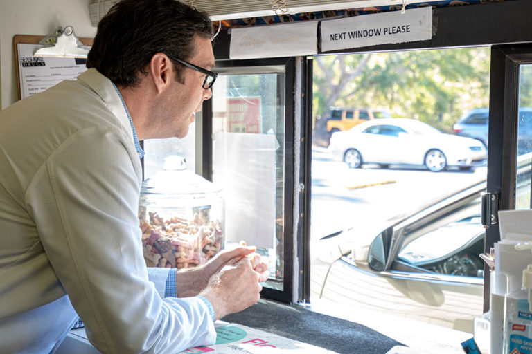 medical supplies calabash, nc, image of Ed Thomas, PharmD, RPh working the drive through pharmacy window