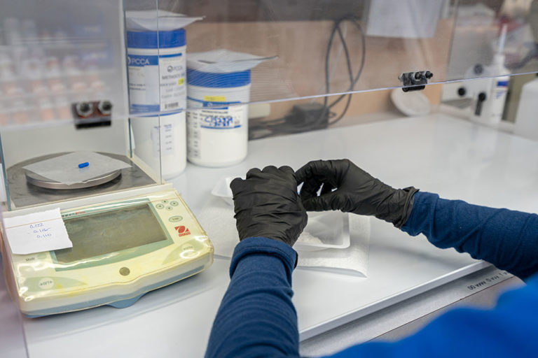 Compounding Pharmacist, Image of one of our pharmacists preparing a drug compound order.