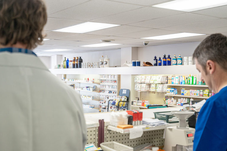 pharmacy shallotte nc, image of staff working behind the counter of the pharmacy