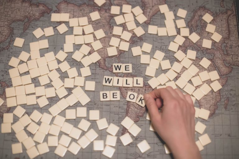 COVID-19 Immunity, image of scrabble tiles saying "We will be OK"