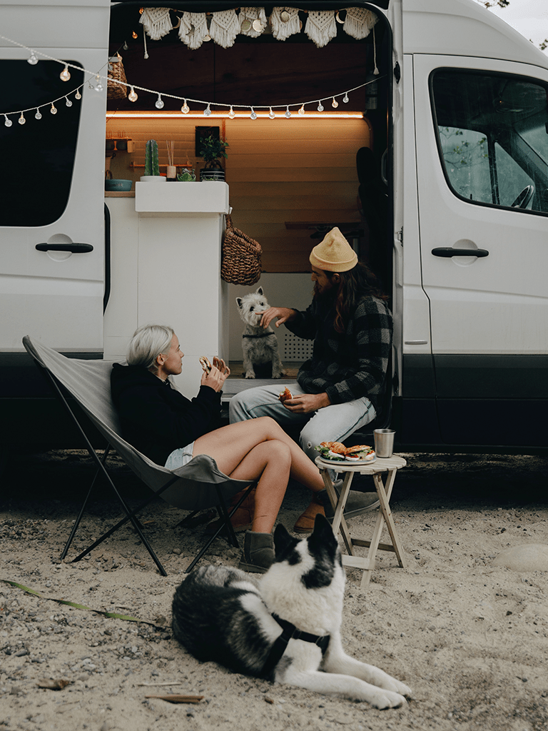 Attractions in Longs, South Carolina, image of a family with two dogs in a camping RV in Longs, SC.