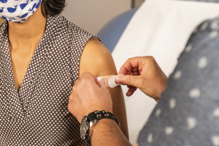 Boost Immunity, image of a woman getting a vaccine shot.