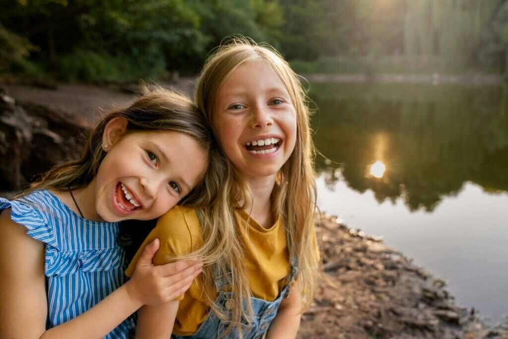 two girls smiling and playing
